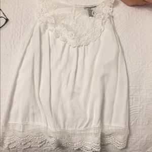 white tank top with lace at the top and bottom